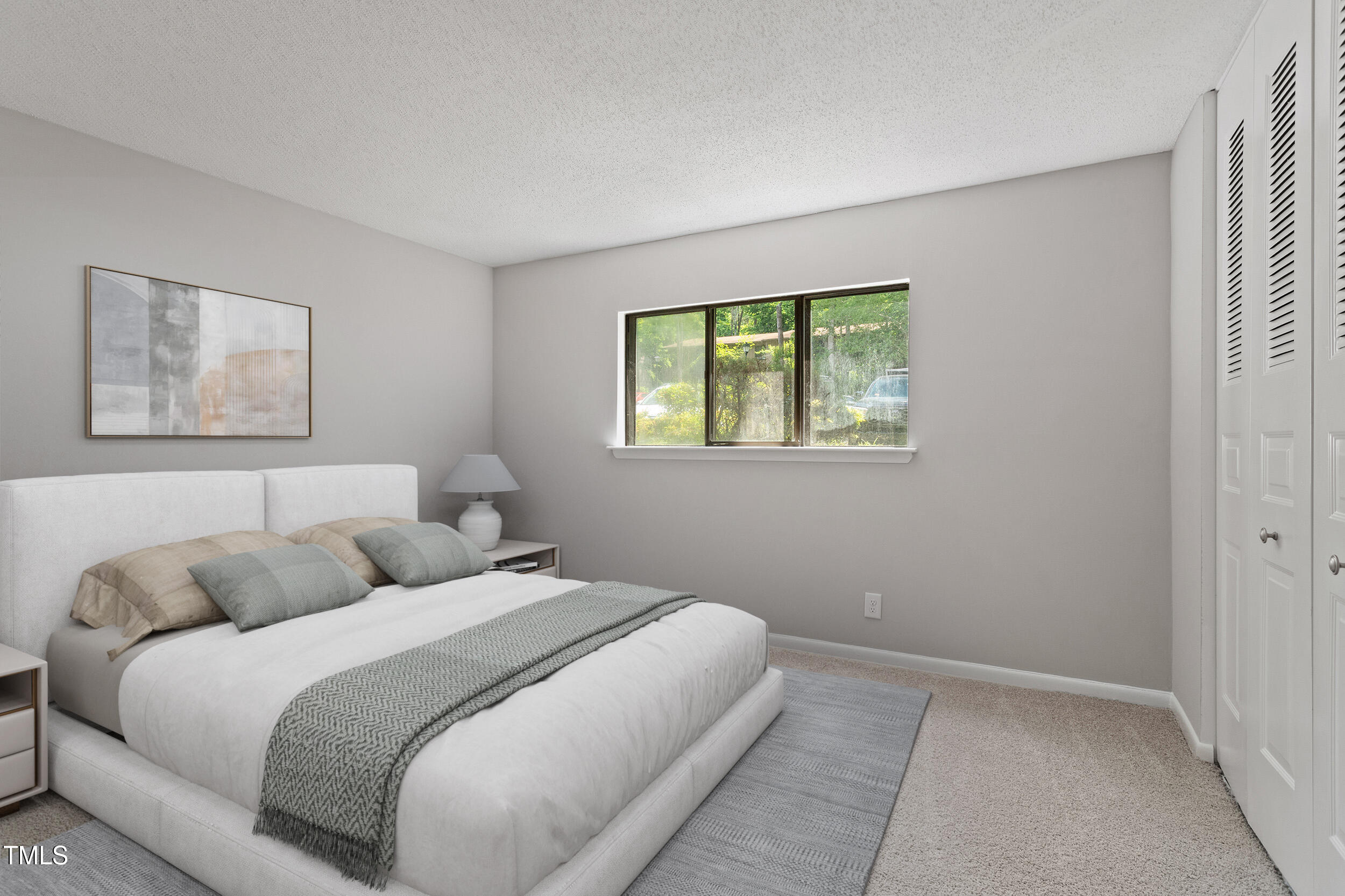 3088 Colony Road, Unit A Durham, NC 27705 - Photo 6 of 24 a bedroom with a bed and a window