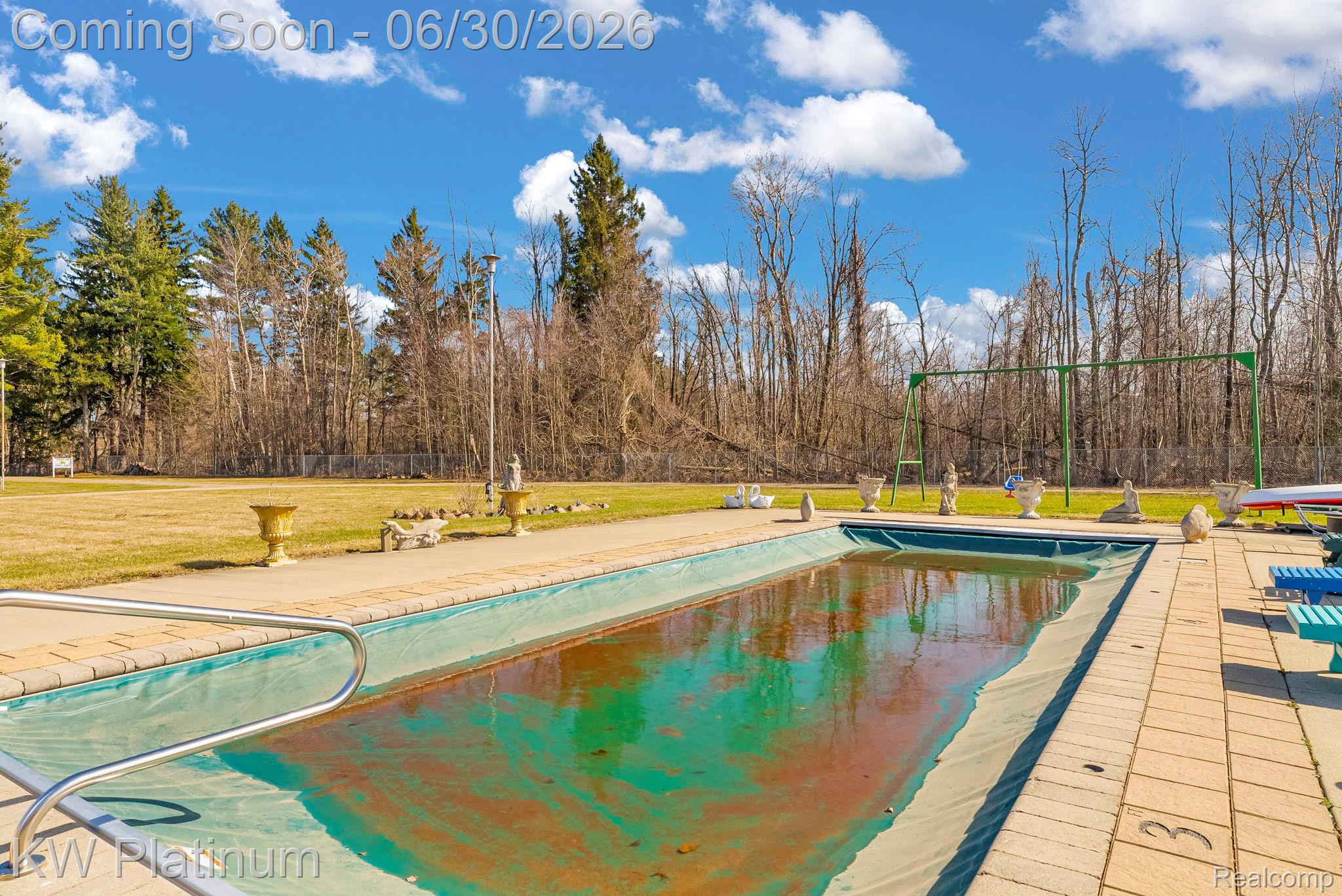 2235 South Lake Shore Road Harbor Beach, MI 48441 - Photo 51 of 99 Rectangular inground pool surrounded by concrete coping and paver decking