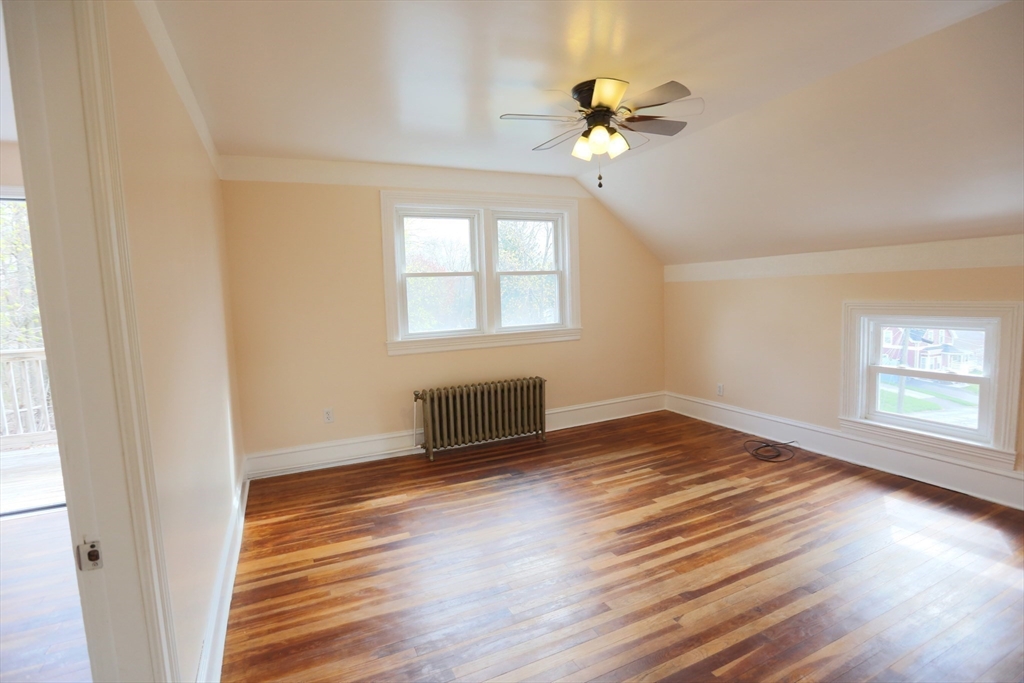 134 Baldwin Street, Unit 2 Fall River, MA 02720 - Photo 12 of 30 wooden floor in an empty room with a window