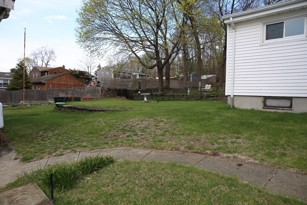 134 Baldwin Street, Unit 2 Fall River, MA 02720 - Photo 16 of 30 a view of a house with a yard