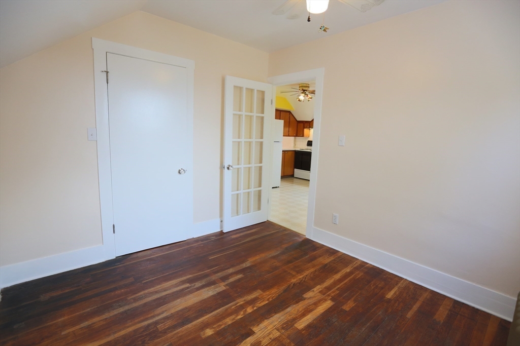 134 Baldwin Street, Unit 2 Fall River, MA 02720 - Photo 19 of 30 a view of empty room with wooden floor