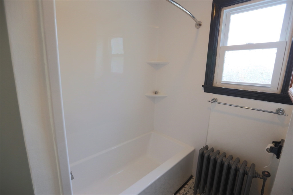 134 Baldwin Street, Unit 2 Fall River, MA 02720 - Photo 21 of 30 a bathroom with a bathtub