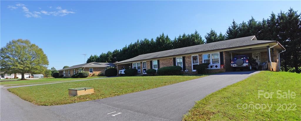 4887 County Home Road, Unit A1J2 Conover, NC 28613 - Photo 11 of 28 a front view of a house with garden
