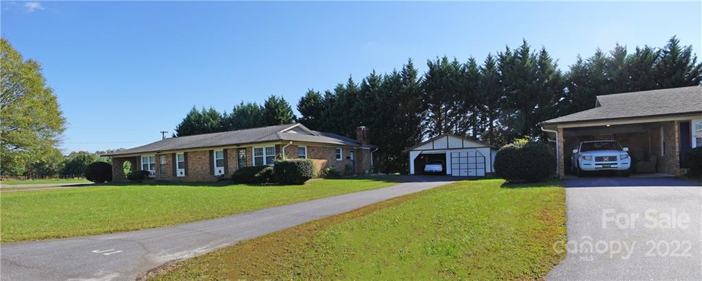 4887 County Home Road, Unit A1J2 Conover, NC 28613 - Photo 12 of 28 a front view of a house with a yard and green space