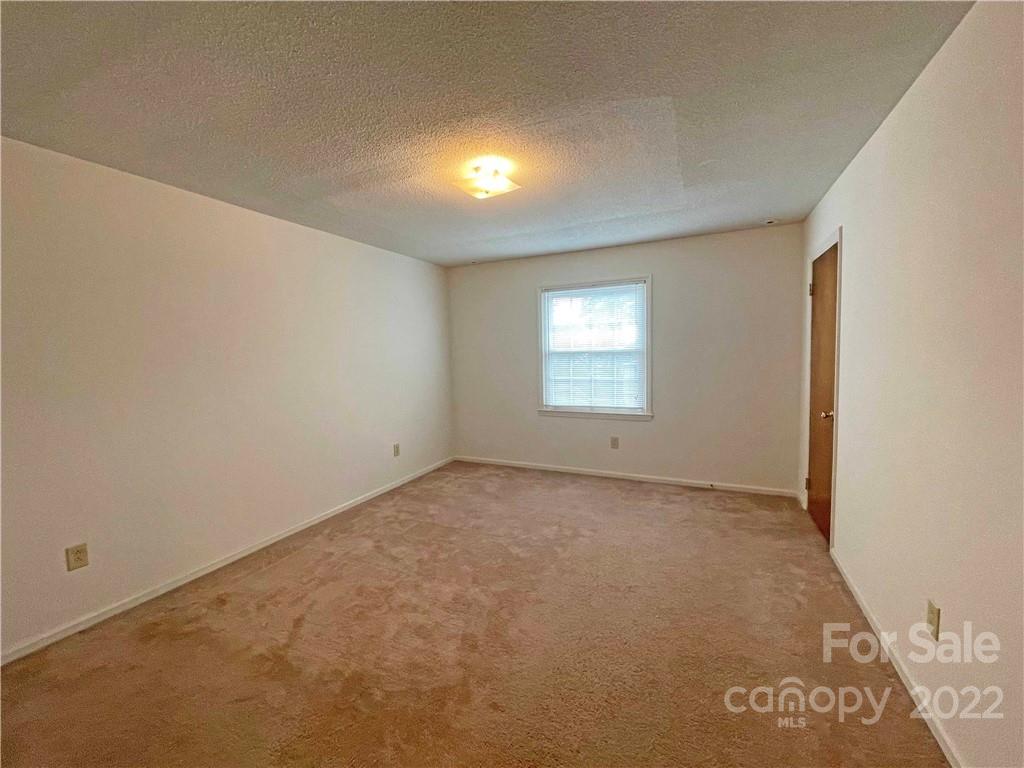 4887 County Home Road, Unit A1J2 Conover, NC 28613 - Photo 20 of 28 an empty room with windows