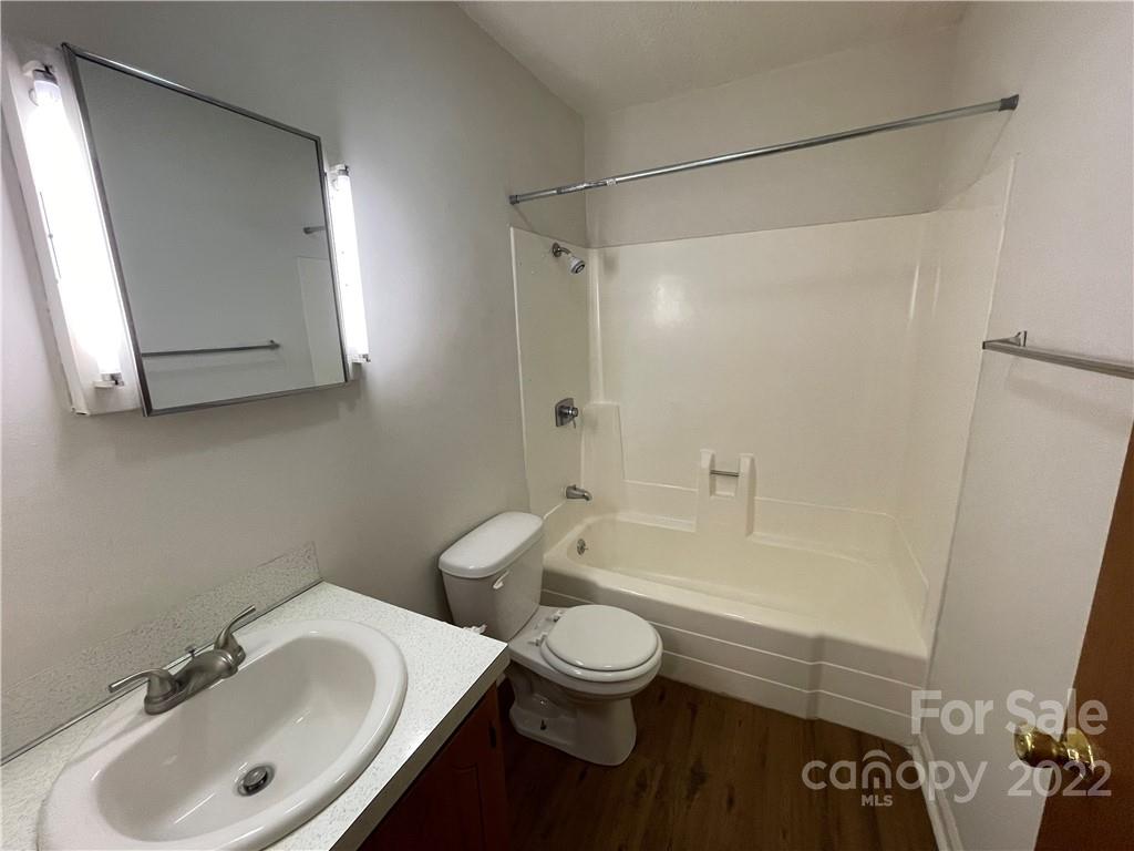 4887 County Home Road, Unit A1J2 Conover, NC 28613 - Photo 24 of 28 a bathroom with a sink toilet and shower