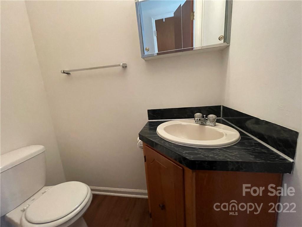 4887 County Home Road, Unit A1J2 Conover, NC 28613 - Photo 25 of 28 a sink with a toilet and a sink