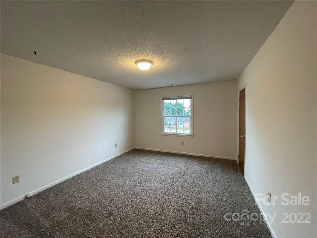 4887 County Home Road, Unit A1J2 Conover, NC 28613 - Photo 26 of 28 an empty room with windows