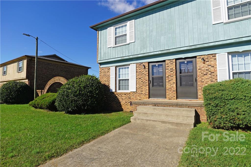 4887 County Home Road, Unit A1J2 Conover, NC 28613 - Photo 3 of 28 a front view of a house with a yard