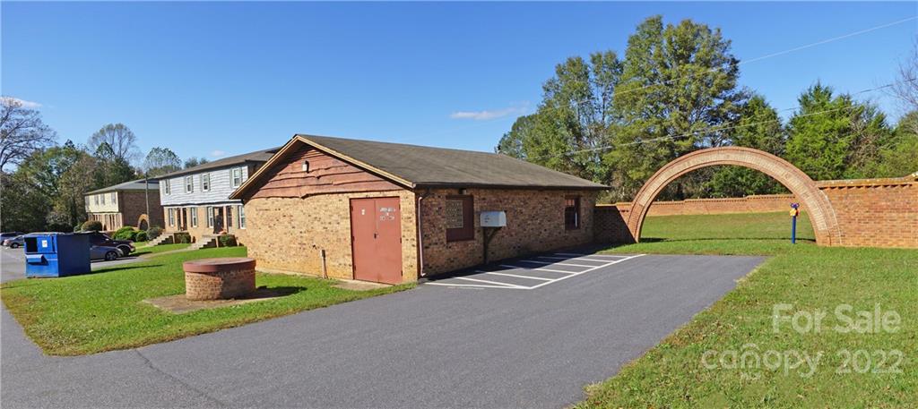 4887 County Home Road, Unit A1J2 Conover, NC 28613 - Photo 7 of 28 a front view of a house with a yard and garage