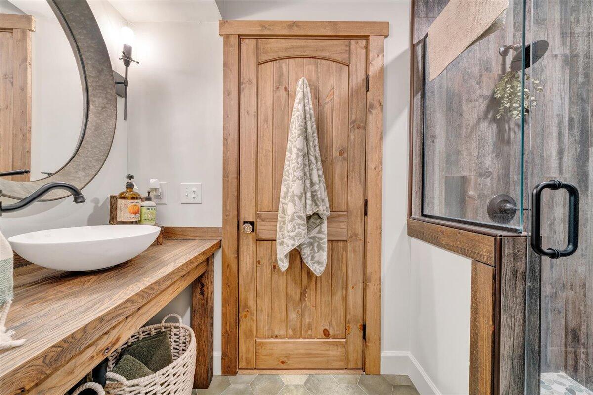3851 Joppa Mill Road Moneta, VA 24121 - Photo 51 of 104 a bathroom with a sink a vanity and a mirror