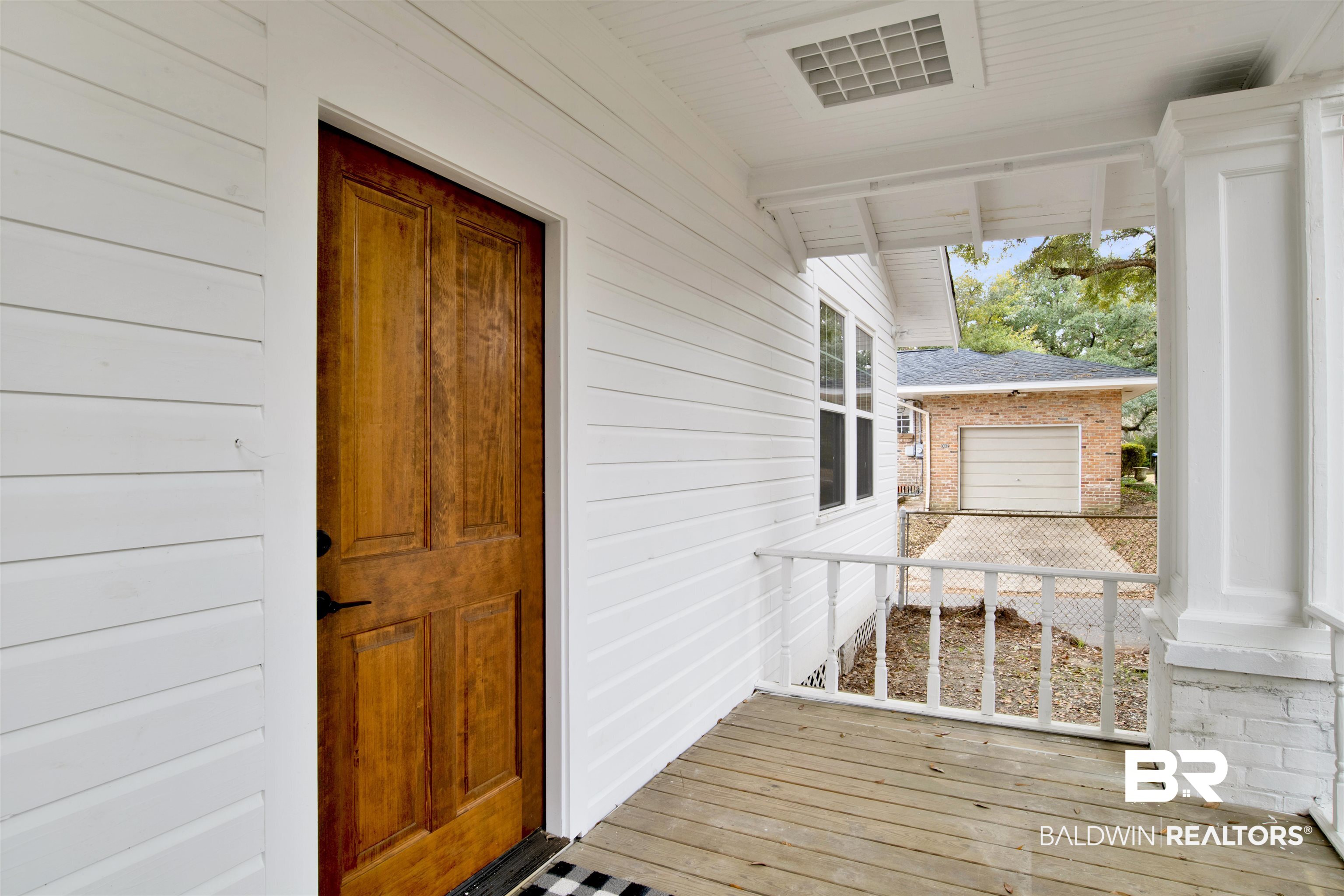 302 1st Street Mobile, AL 36611 - Photo 4 of 28 Property entrance featuring a garage and covered porch