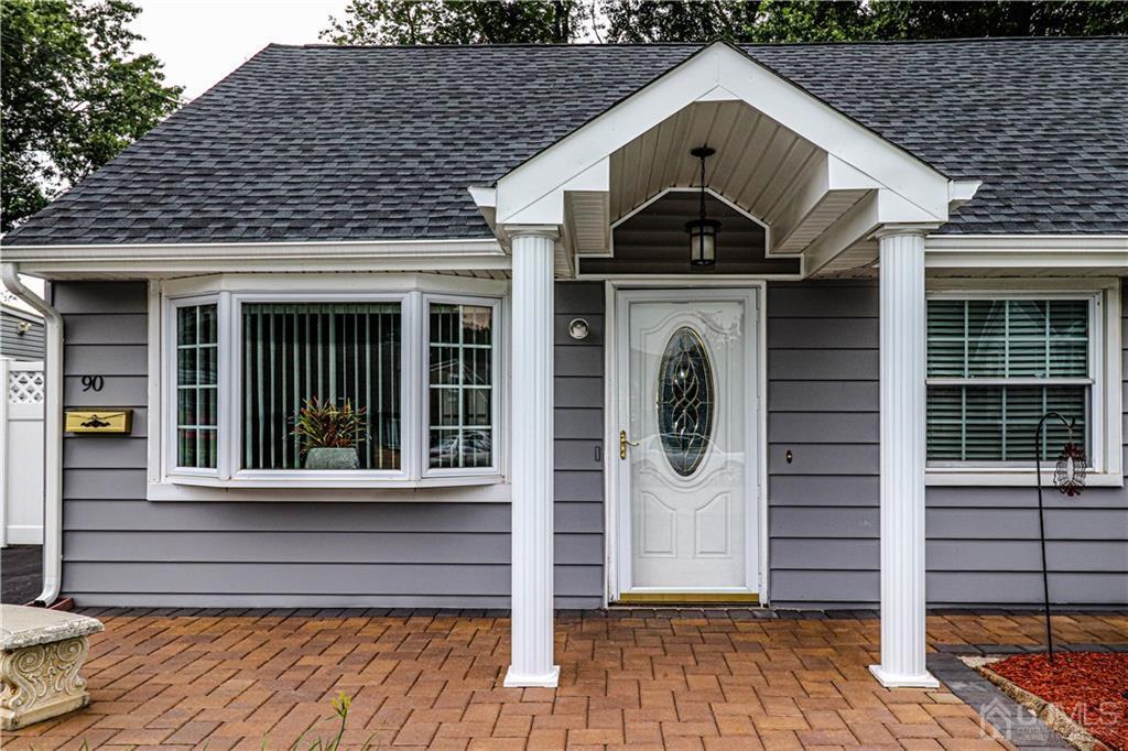 90 Ashley Road Edison, NJ 08817 - Photo 3 of 32 a front view of a house with a garden