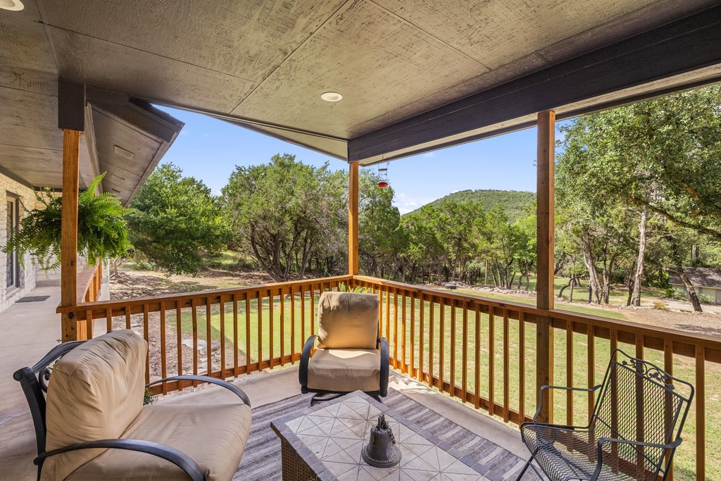 23644 Nameless Road Leander, TX 78641 - Photo 20 of 40 Enjoy tranquil views of the verdant landscape from this inviting, shaded patio.