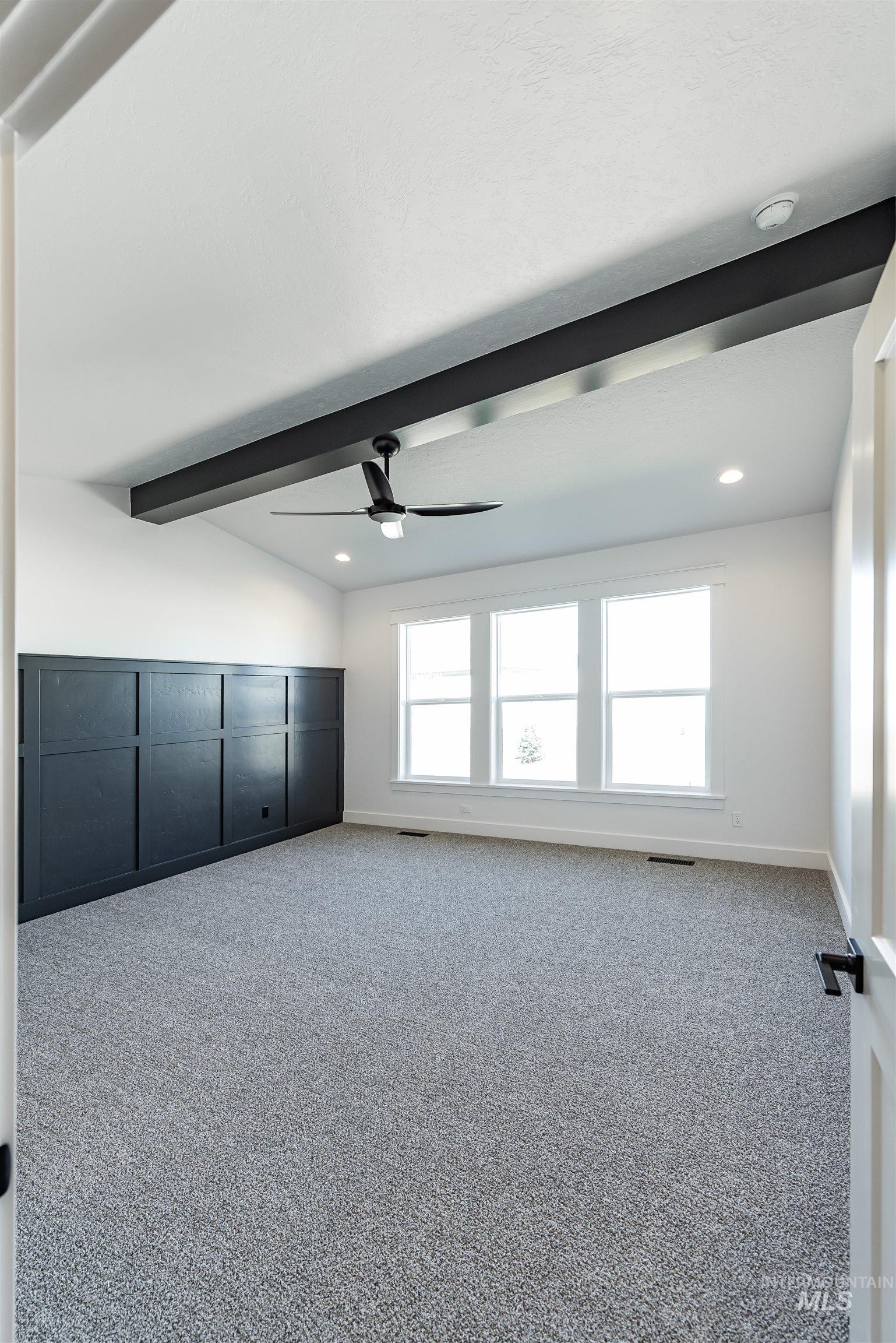 400 South Diesel Way Boise, ID 83716 - Photo 16 of 44 Unfurnished room with carpet floors, vaulted ceiling with beams, recessed lighting, and a ceiling fan