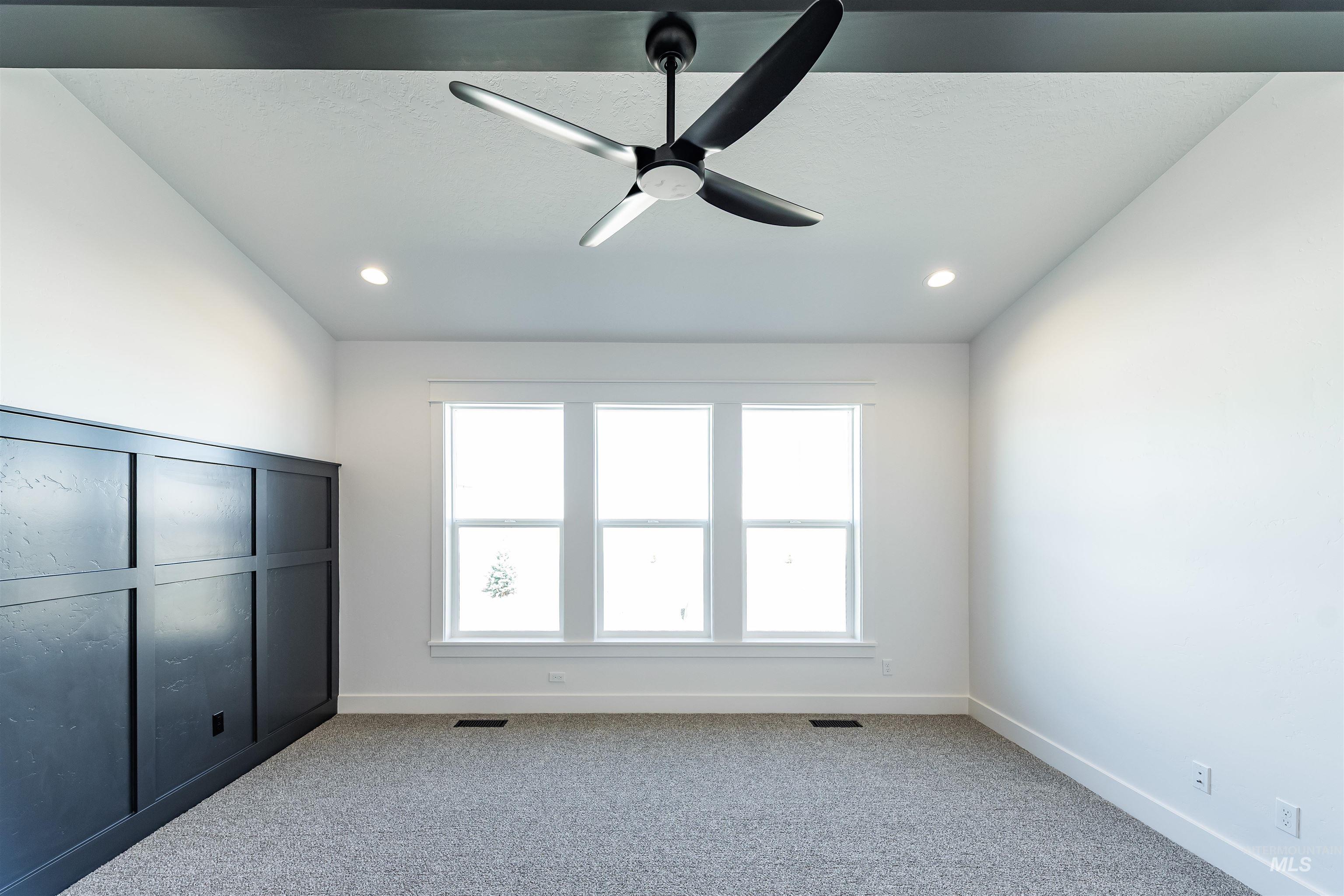 400 South Diesel Way Boise, ID 83716 - Photo 18 of 44 Unfurnished bedroom featuring carpet floors and a ceiling fan