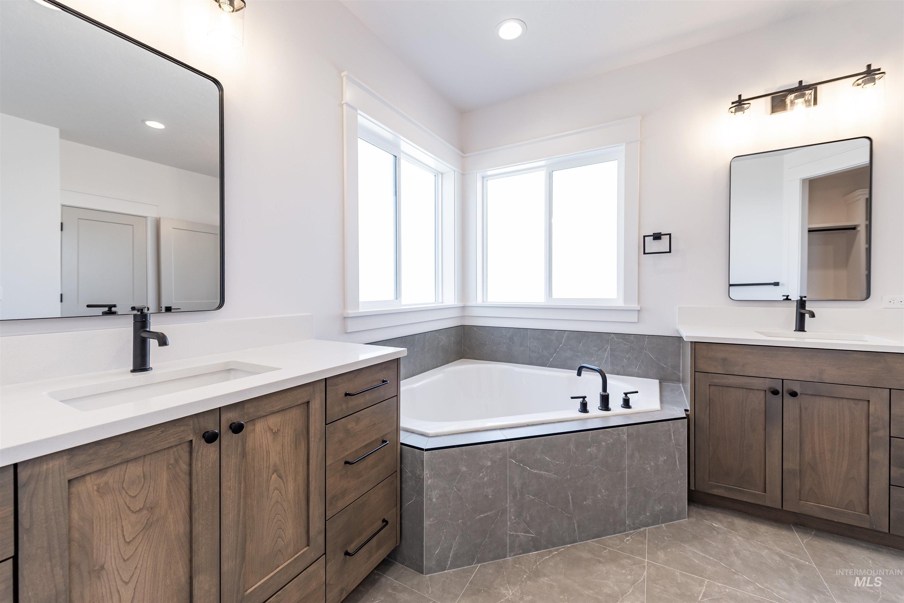 400 South Diesel Way Boise, ID 83716 - Photo 20 of 44 Bathroom with two vanities, a garden tub, and recessed lighting
