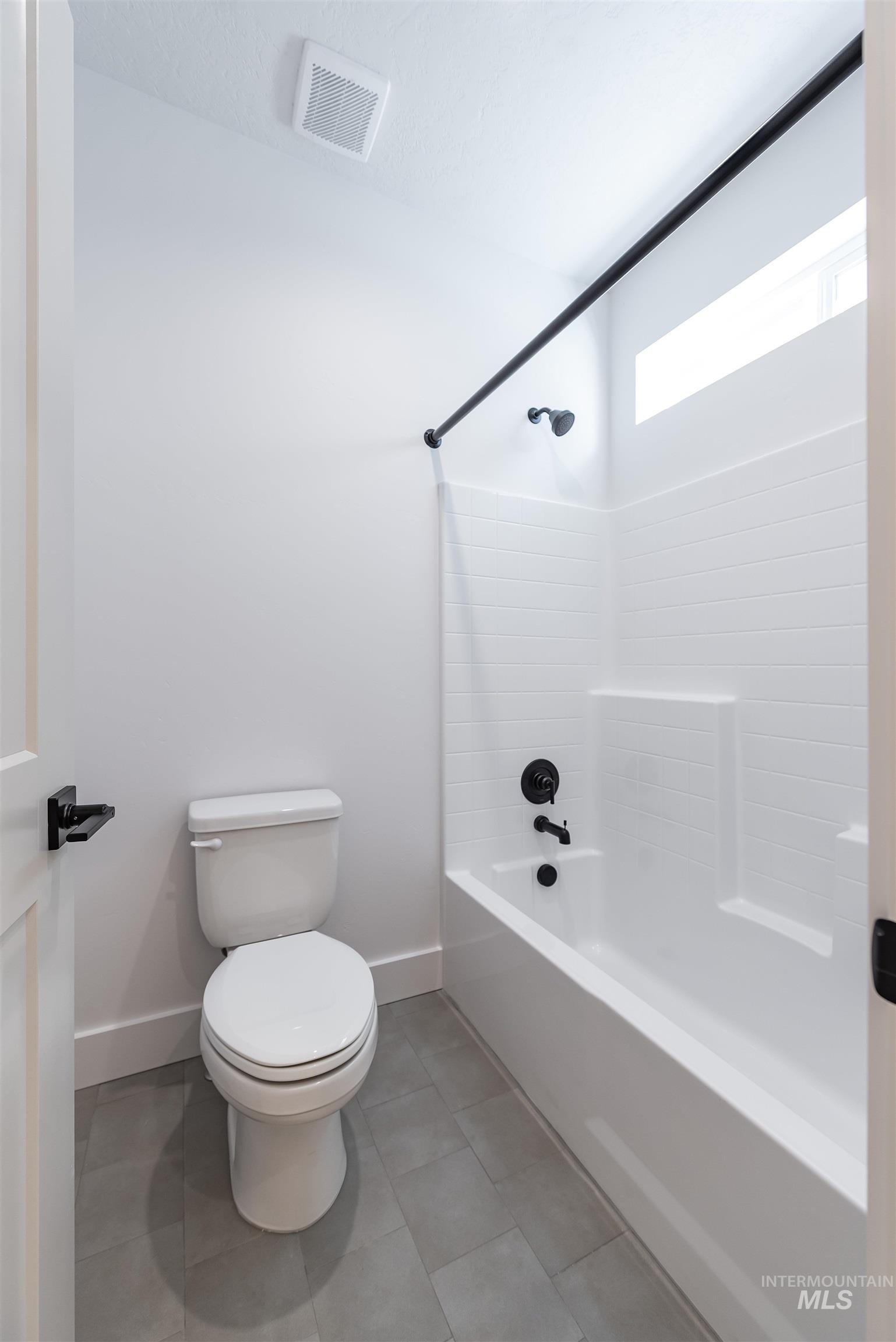 400 South Diesel Way Boise, ID 83716 - Photo 29 of 44 Full bathroom with bathing tub / shower combination and light tile patterned floors