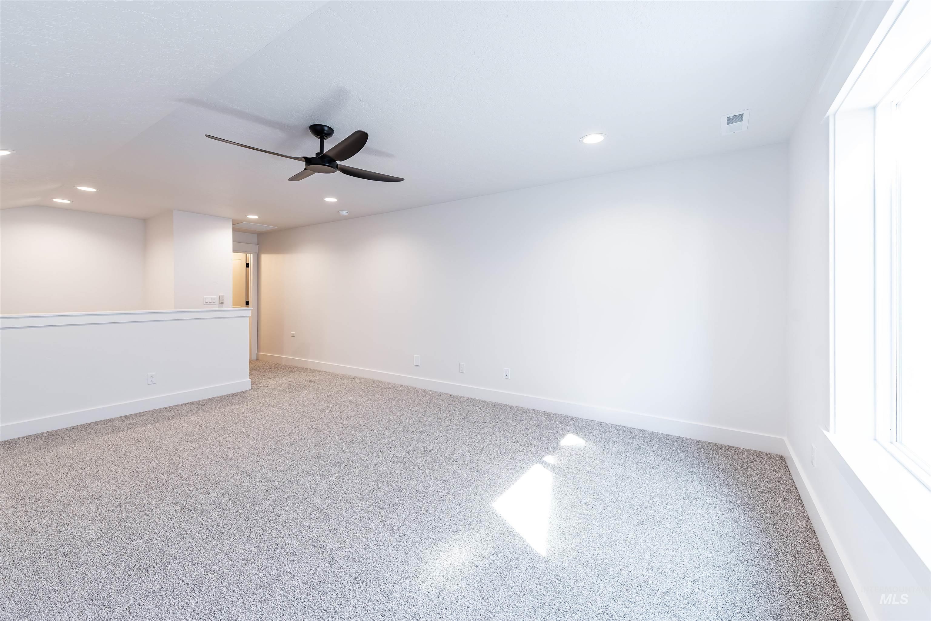 400 South Diesel Way Boise, ID 83716 - Photo 36 of 44 Spare room featuring light colored carpet, ceiling fan, and recessed lighting