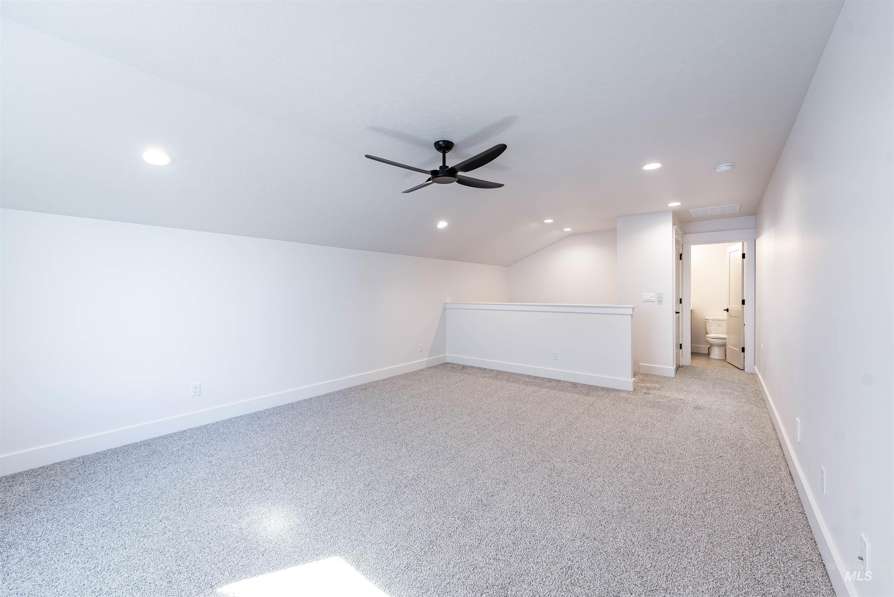 400 South Diesel Way Boise, ID 83716 - Photo 37 of 44 Bonus room featuring a ceiling fan, lofted ceiling, and recessed lighting