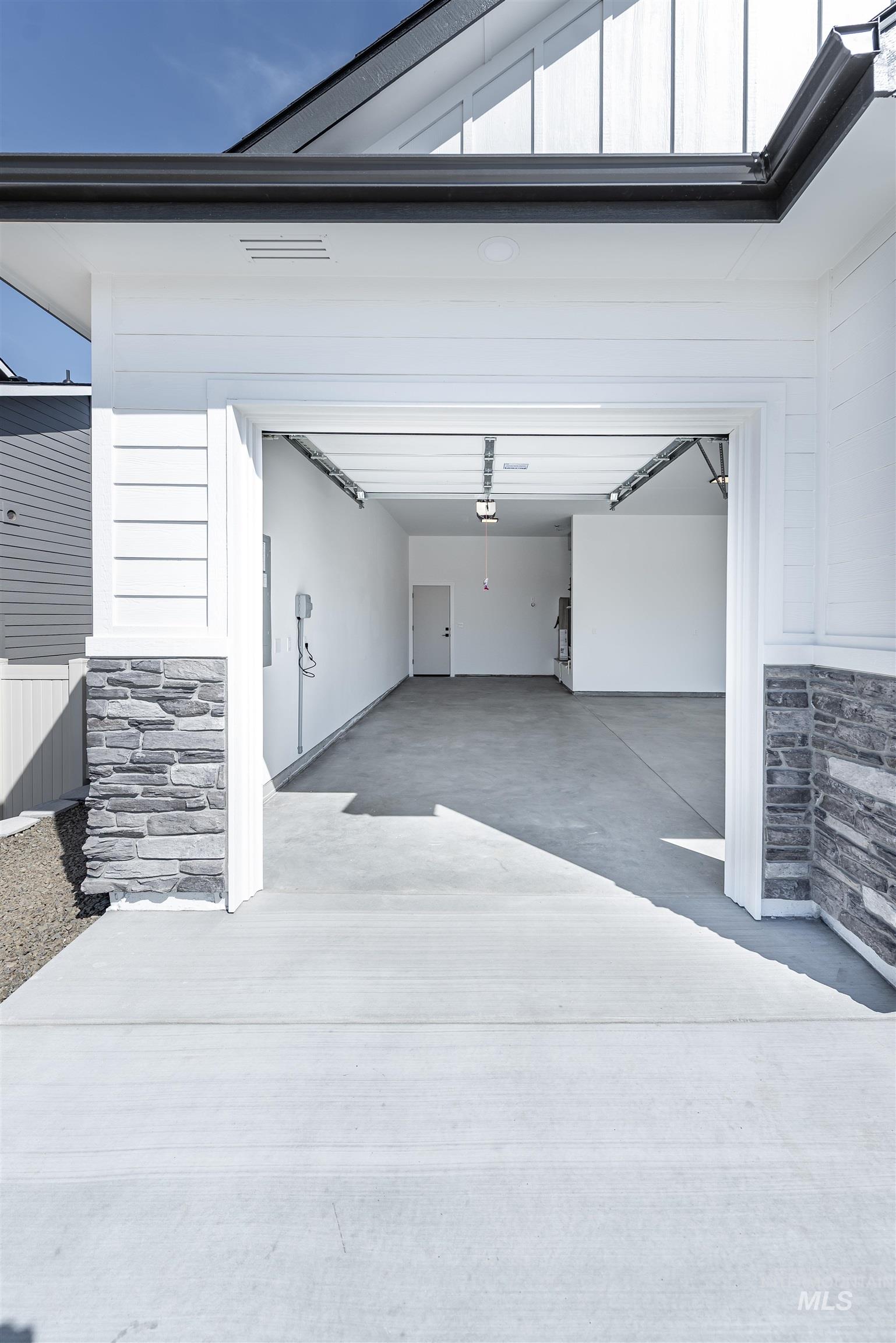 400 South Diesel Way Boise, ID 83716 - Photo 40 of 44 Garage featuring concrete driveway