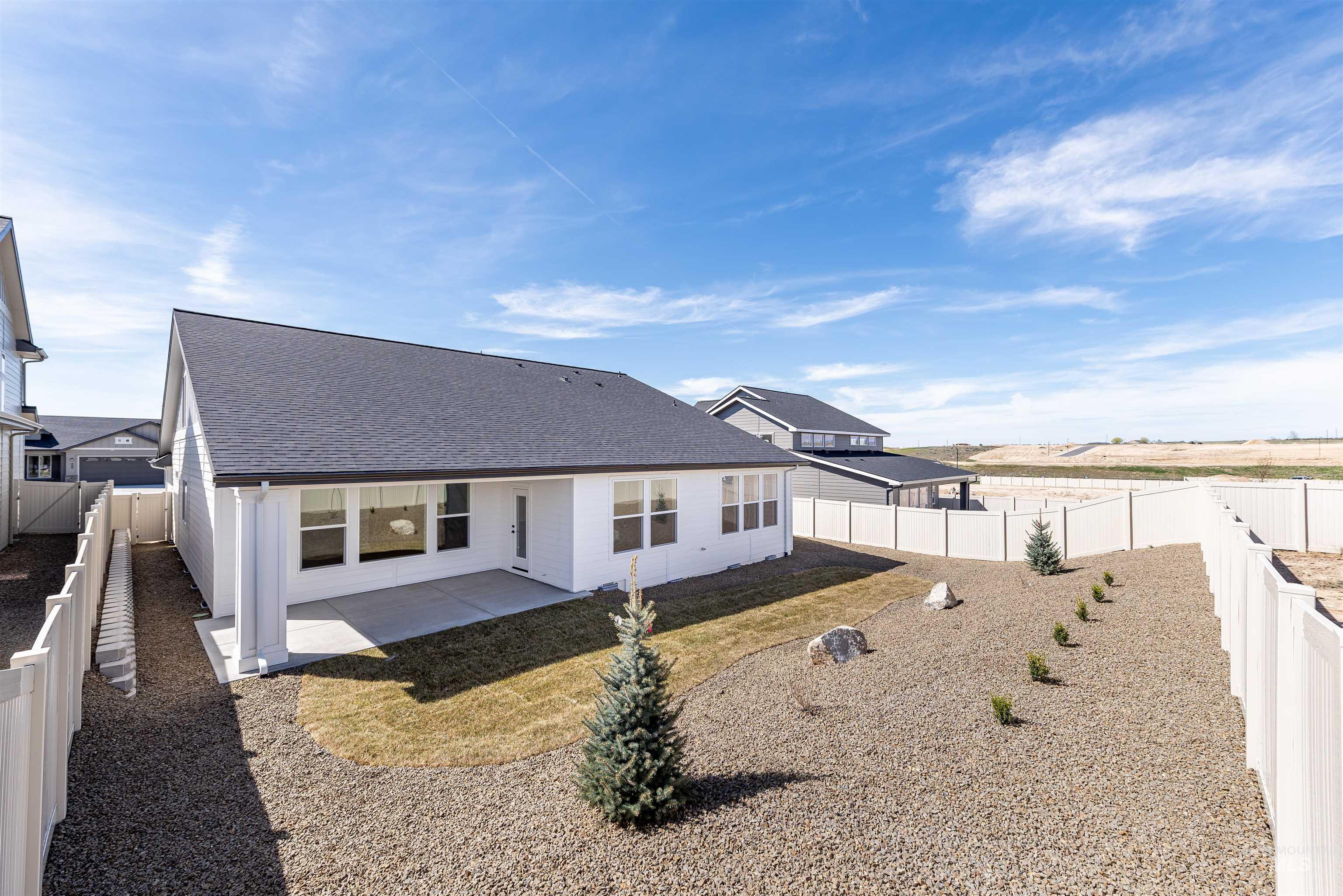 400 South Diesel Way Boise, ID 83716 - Photo 42 of 44 Rear view of property featuring a patio area, a shingled roof, and a fenced backyard