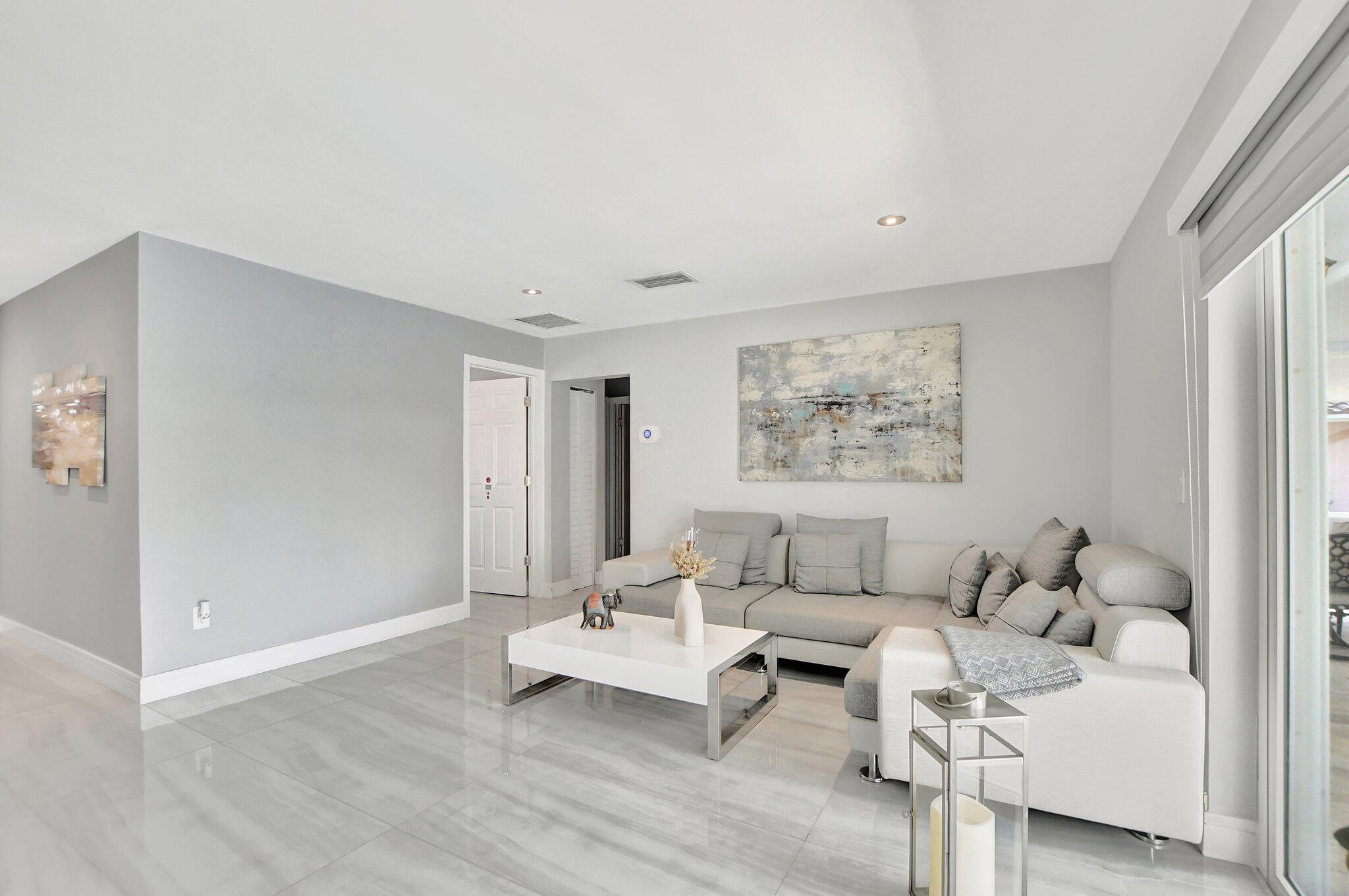 19463 Colorado Circle Boca Raton, FL 33434 - Photo 8 of 48 a living room with furniture and a table