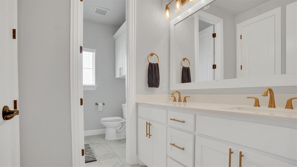 101 Sky Way New Fairview, TX 76078 - Photo 11 of 20 a bathroom with a sink and a mirror