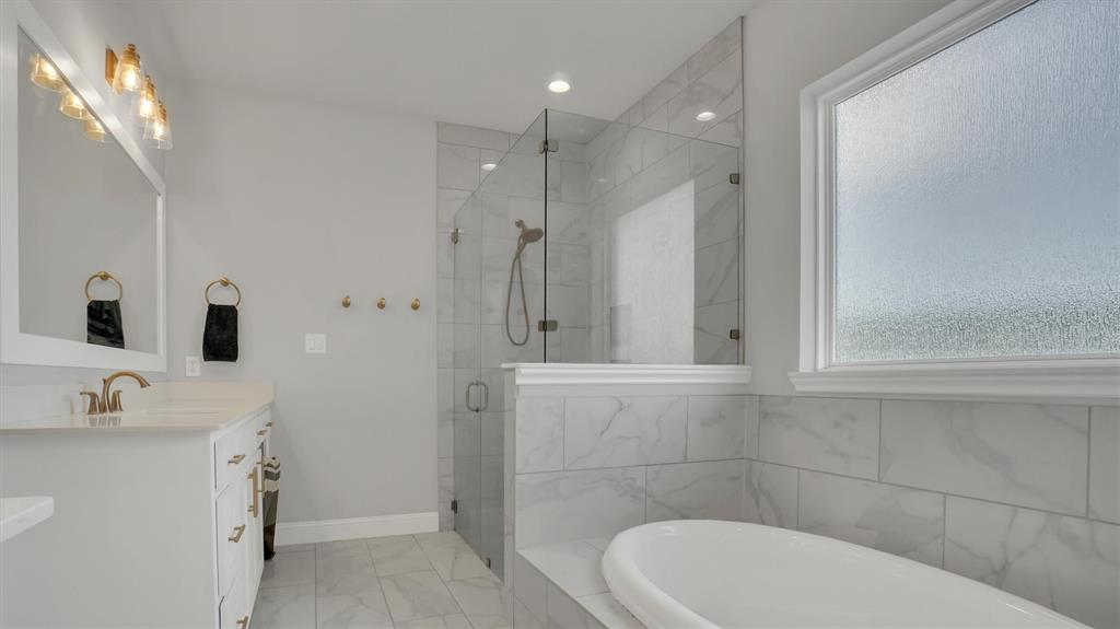 101 Sky Way New Fairview, TX 76078 - Photo 7 of 20 a bathroom with a sink a toilet and shower