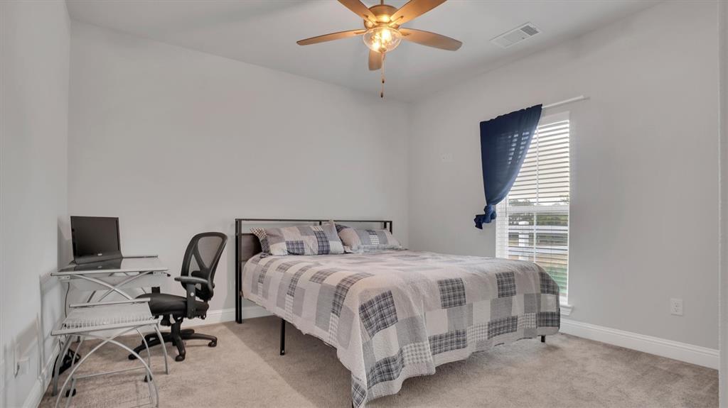 101 Sky Way New Fairview, TX 76078 - Photo 9 of 20 a bedroom with a bed and a window