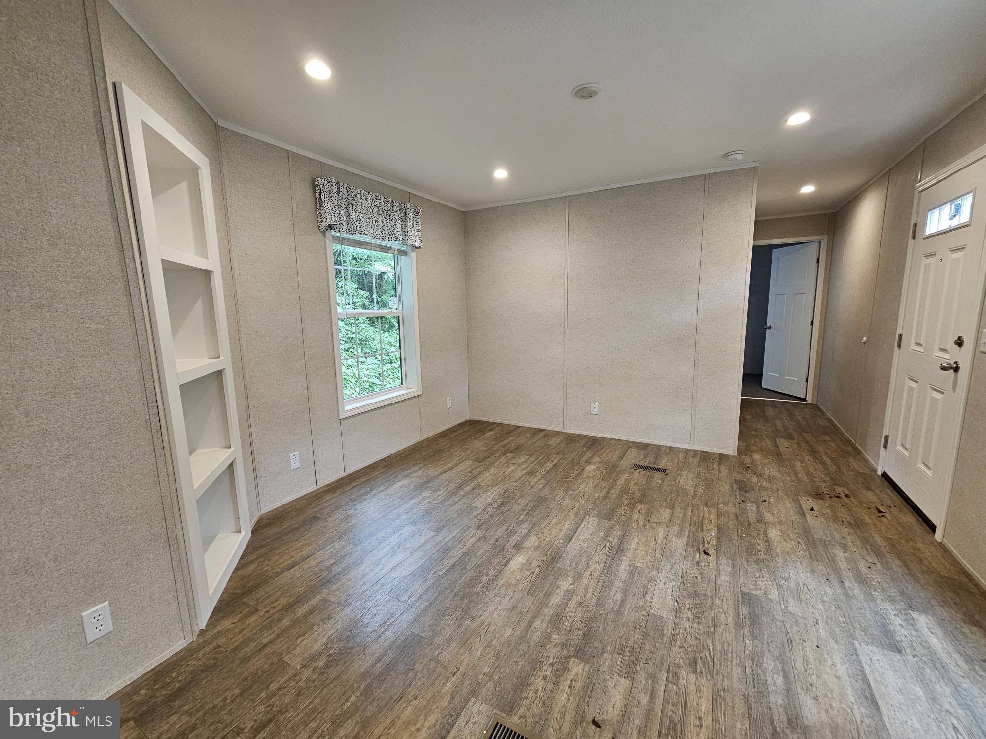 465 Royal Manor Road Easton, PA 18042 - Photo 3 of 14 an empty room with wooden floor and windows