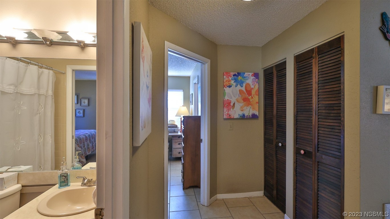 1861 Evergreen Drive Edgewater, FL 32141 - Photo 20 of 31 a bathroom with a sink a toilet and shower
