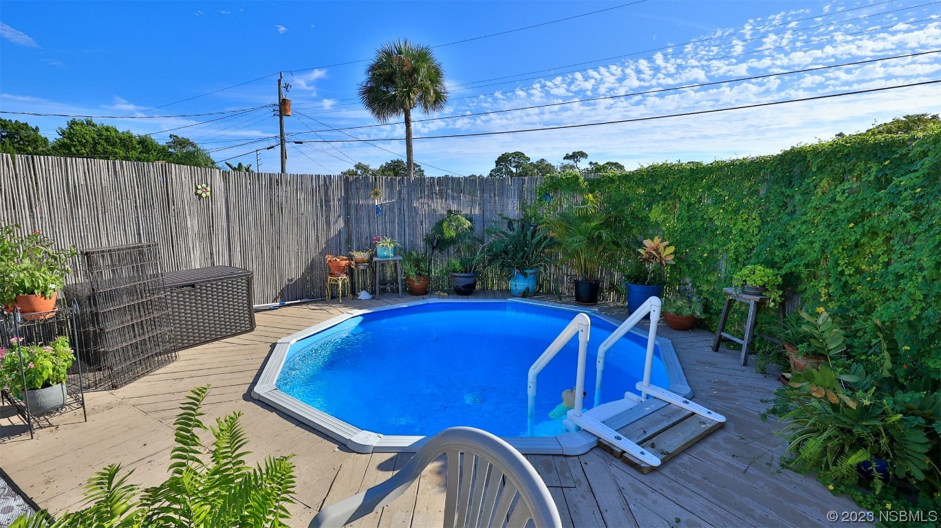 1861 Evergreen Drive Edgewater, FL 32141 - Photo 25 of 31 a view of a chairs and table in patio with potted plants