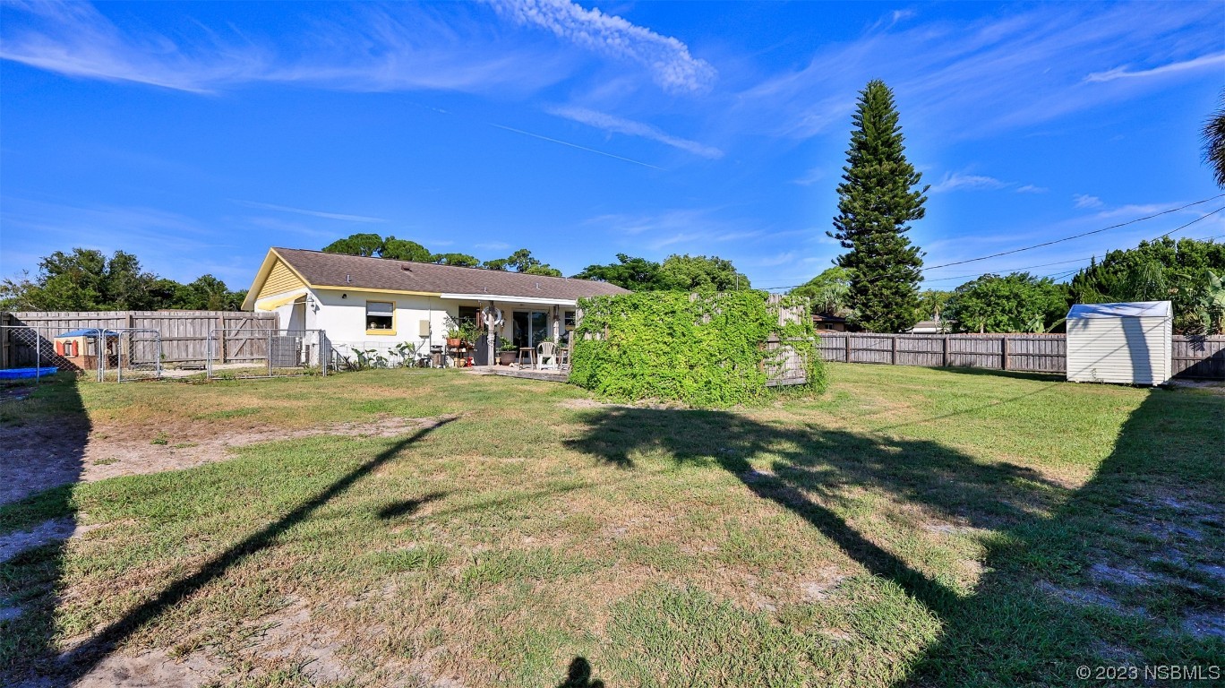 1861 Evergreen Drive Edgewater, FL 32141 - Photo 28 of 31 a view of house with garden space and sitting area
