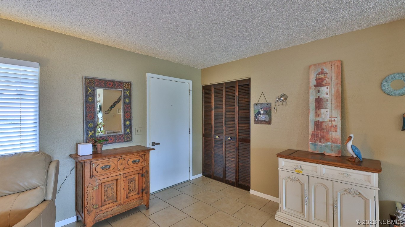 1861 Evergreen Drive Edgewater, FL 32141 - Photo 3 of 31 a view of a bedroom with wooden floor and cabinet