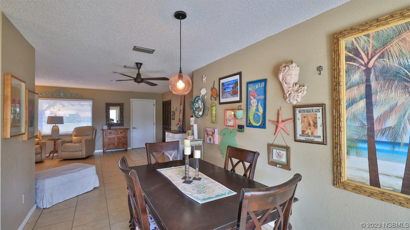 1861 Evergreen Drive Edgewater, FL 32141 - Photo 6 of 31 a living room with furniture and a chandelier