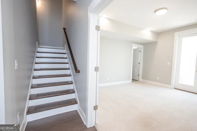 a view of entryway with bedroom and stairs