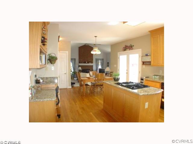 14441 Newgate Road Midlothian, VA 23113 - Photo 5 of 10 a kitchen with a table and chairs