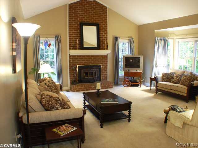 14441 Newgate Road Midlothian, VA 23113 - Photo 6 of 10 a living room with furniture and a fireplace