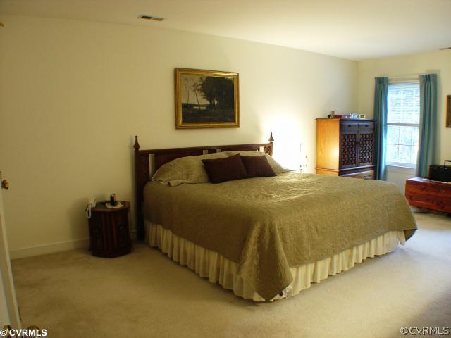 14441 Newgate Road Midlothian, VA 23113 - Photo 7 of 10 a bedroom with a bed and window
