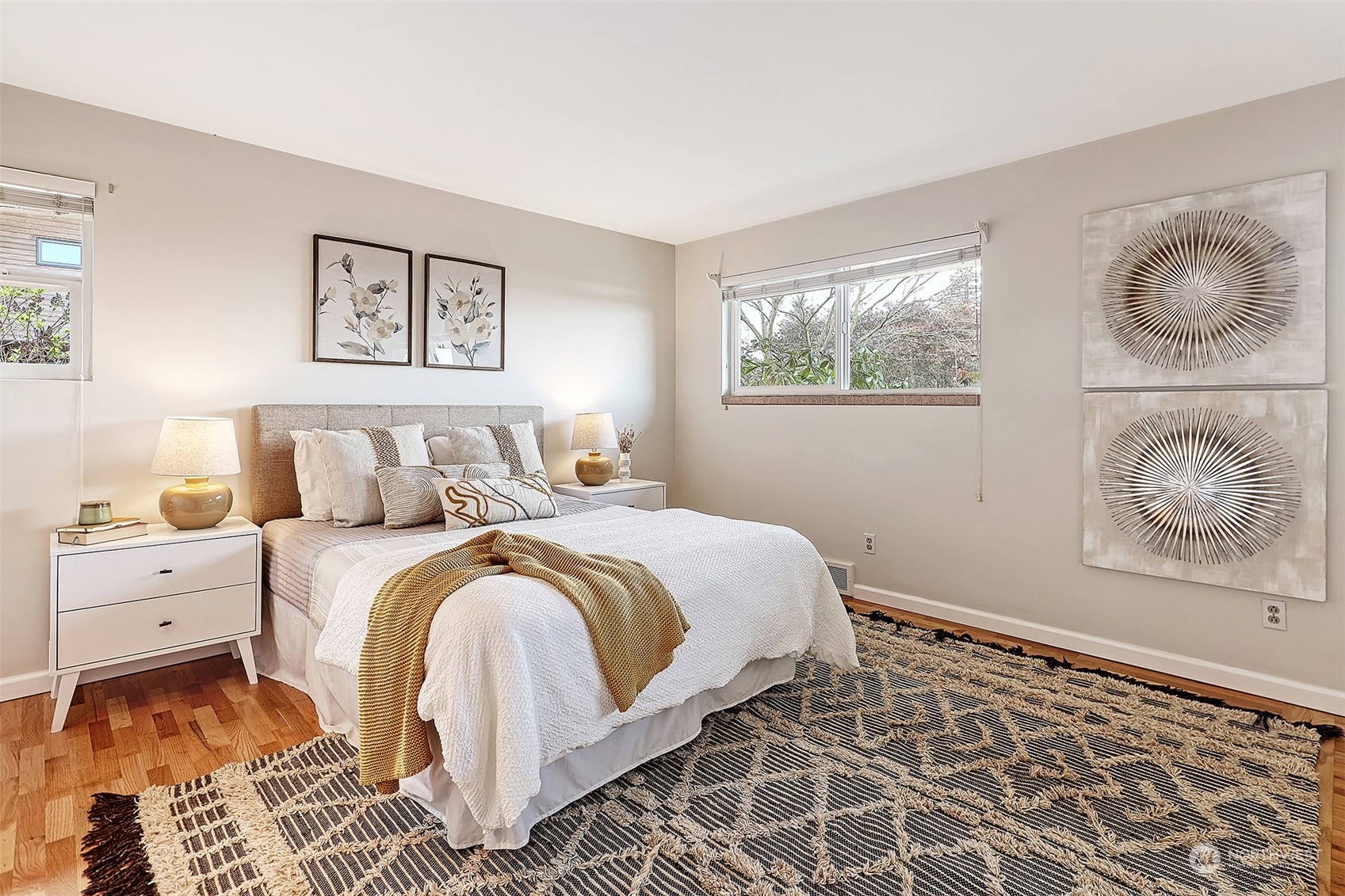 612 9th Avenue North Edmonds, WA 98020 - Photo 12 of 39 a bedroom with a bed and painting on the wall