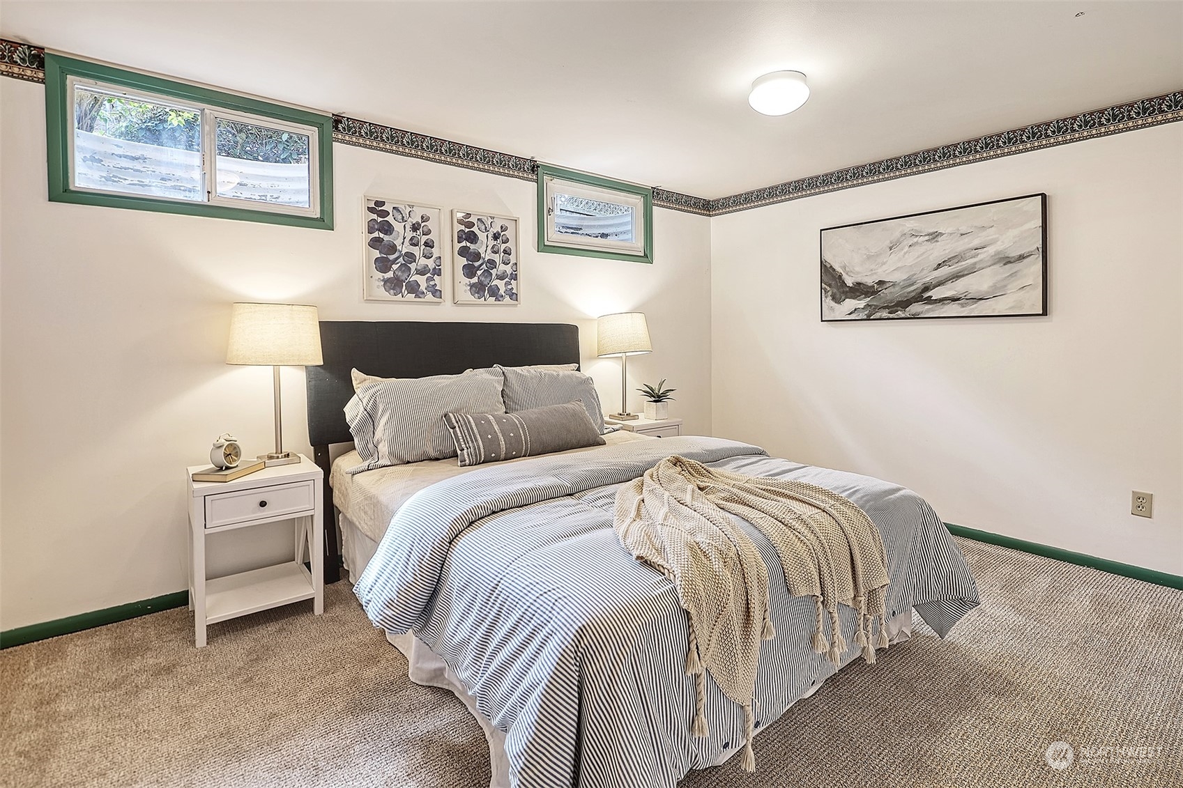 612 9th Avenue North Edmonds, WA 98020 - Photo 19 of 39 a bedroom with a bed and a painting on the wall