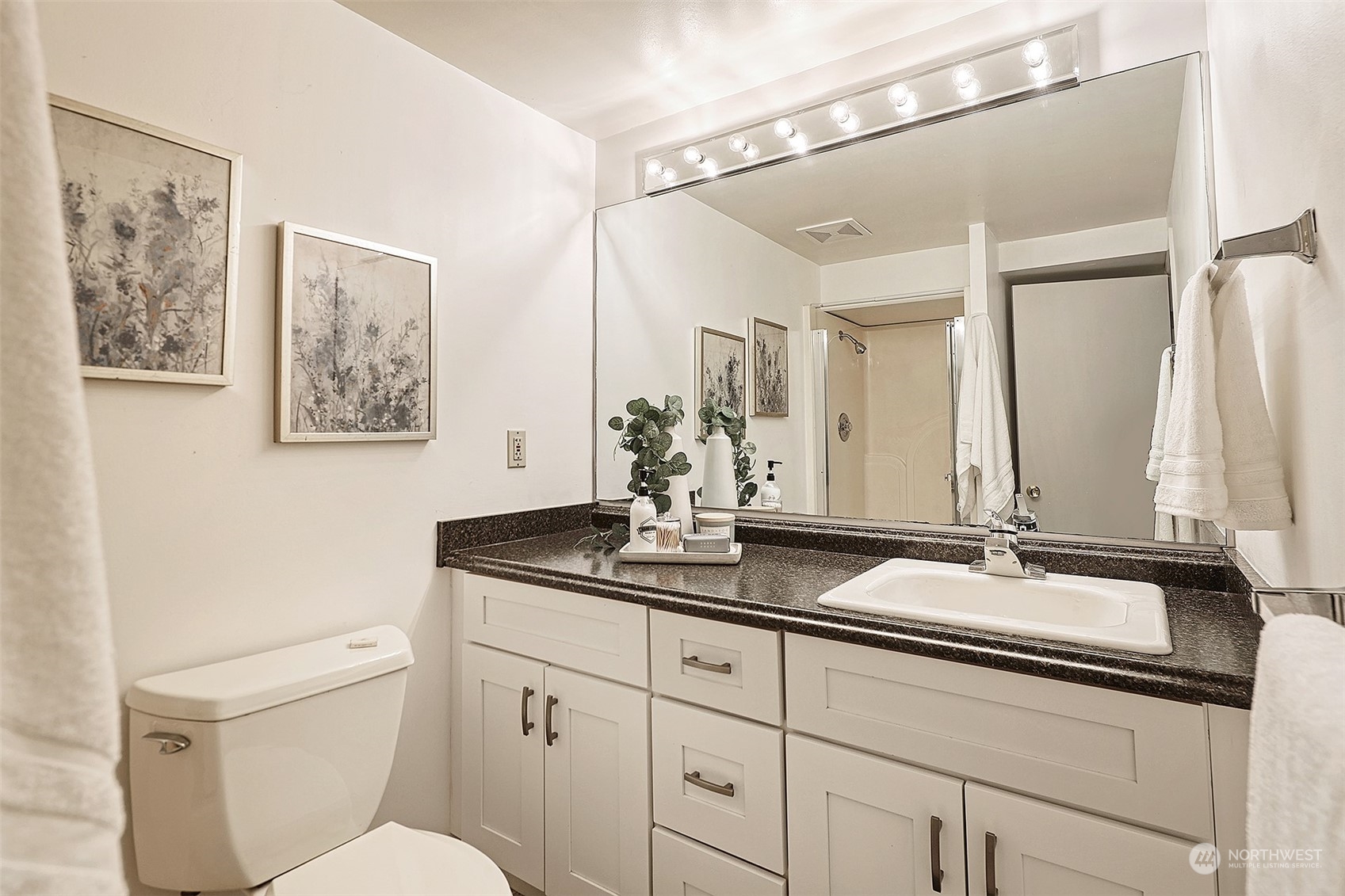 612 9th Avenue North Edmonds, WA 98020 - Photo 21 of 39 a bathroom with a granite countertop sink a toilet and a mirror