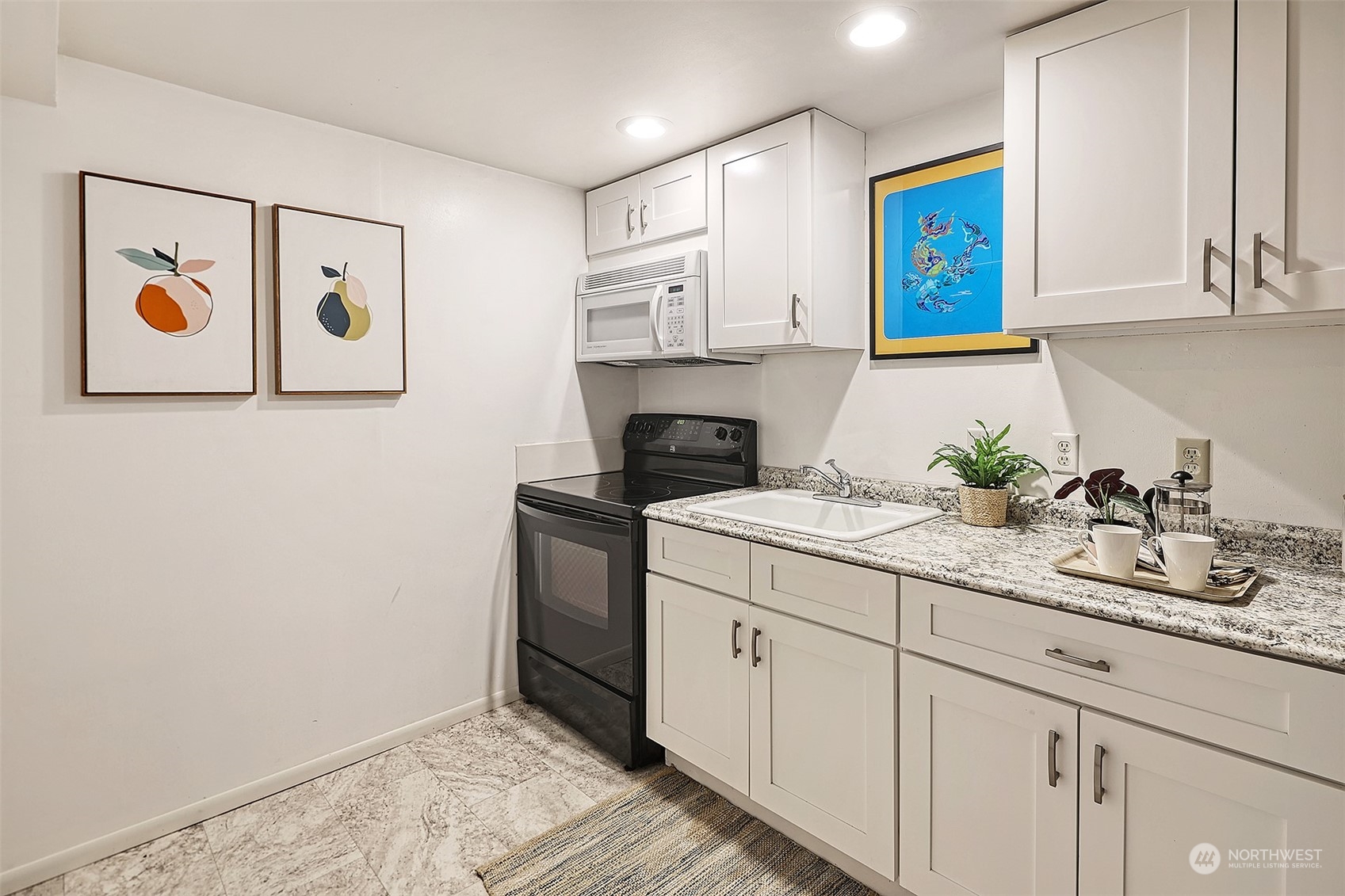 612 9th Avenue North Edmonds, WA 98020 - Photo 22 of 39 a kitchen with cabinets and window