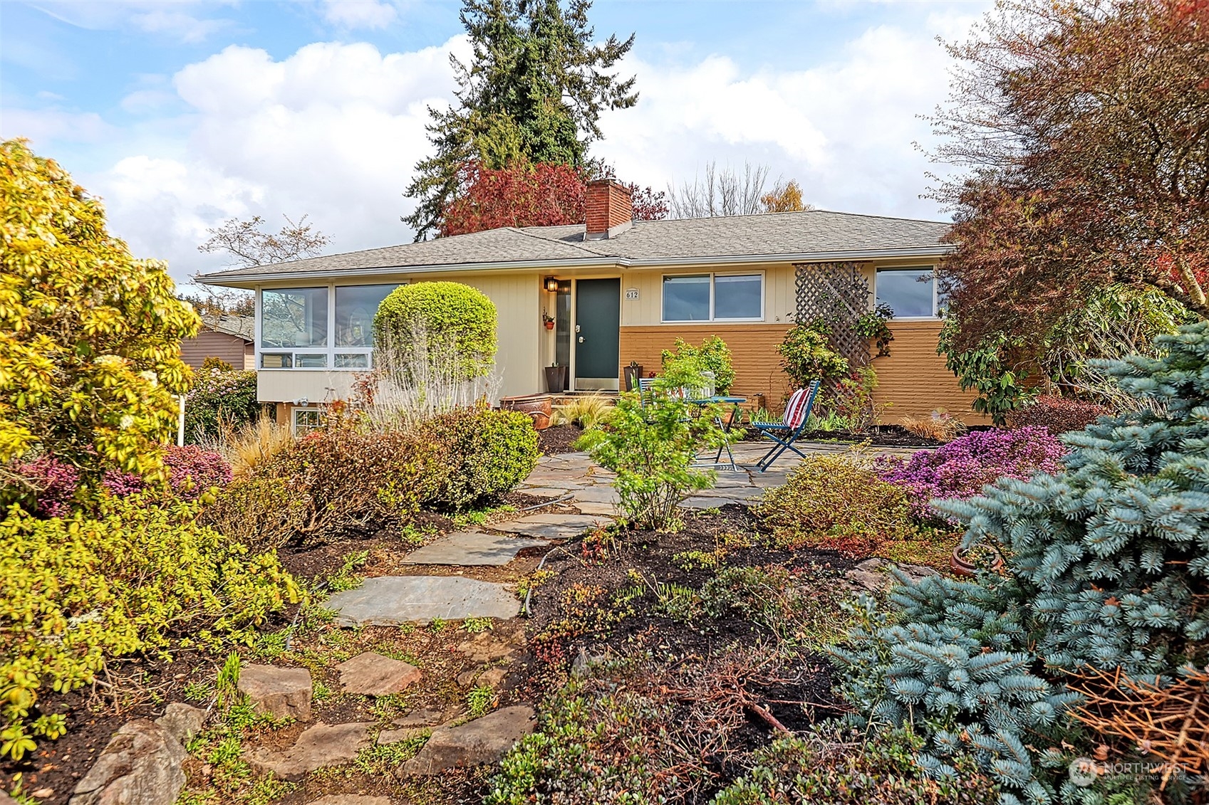 612 9th Avenue North Edmonds, WA 98020 - Photo 25 of 39 a front view of a house with a yard and potted plants