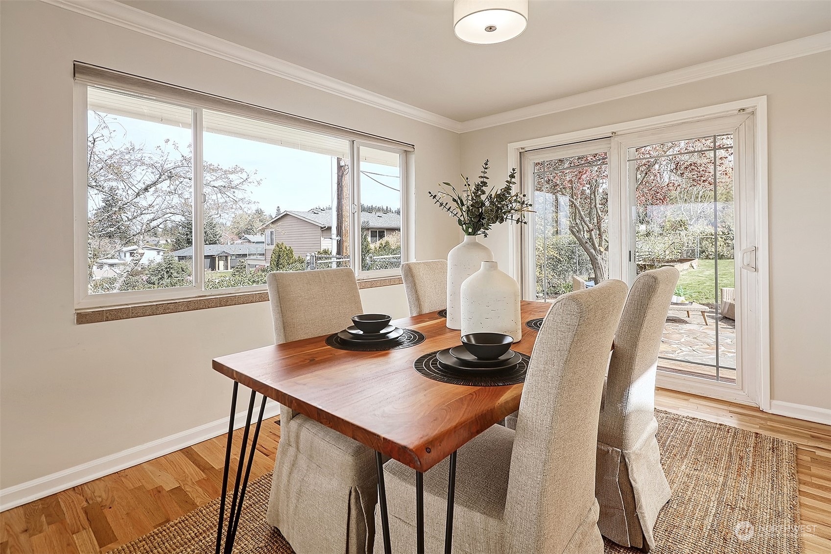 612 9th Avenue North Edmonds, WA 98020 - Photo 7 of 39 a view of a dining room with furniture and wooden floor