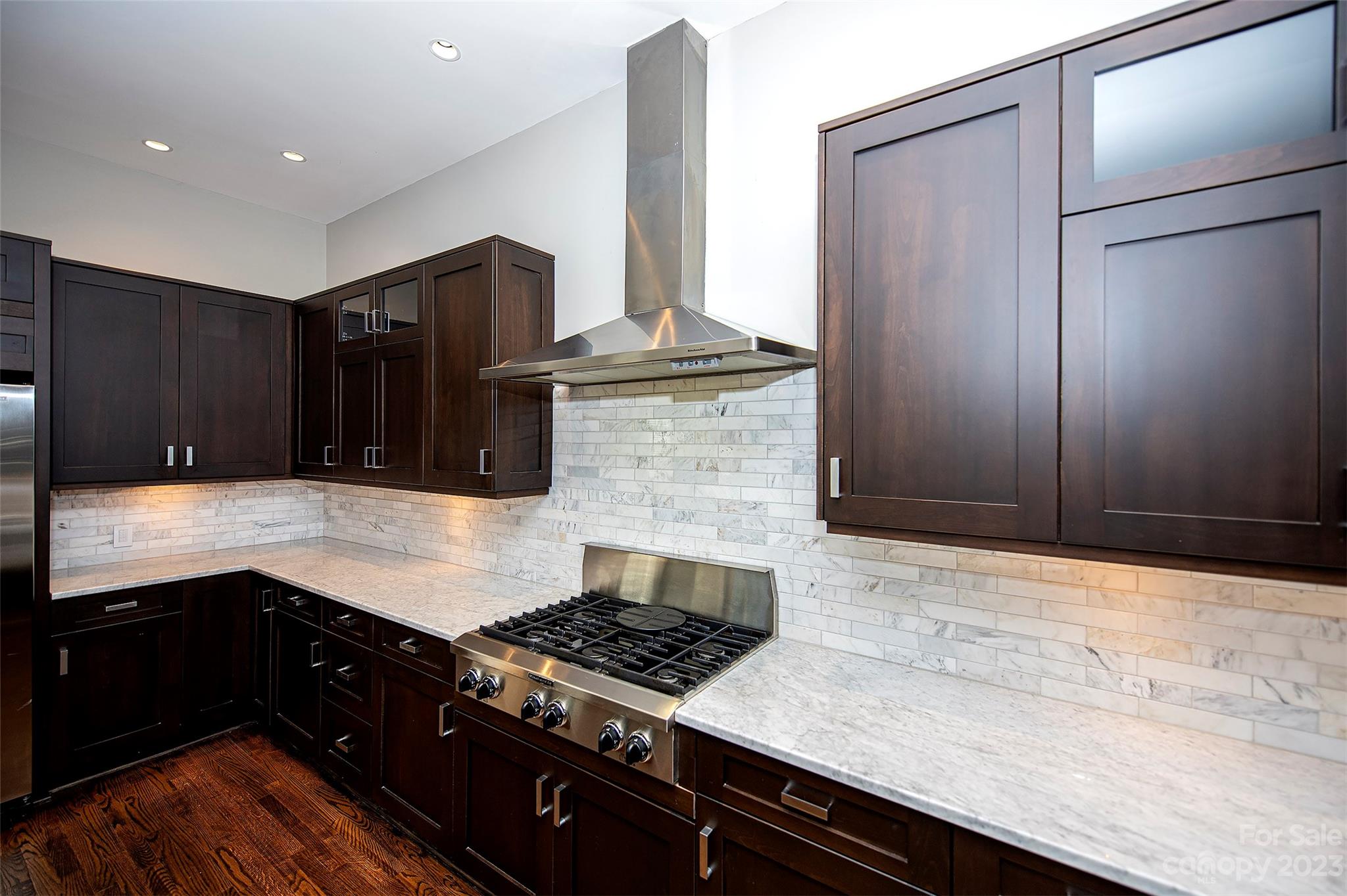 1403 Devon Drive Charlotte, NC 28209 - Photo 11 of 46 a kitchen with granite countertop stainless steel appliances and wooden cabinets