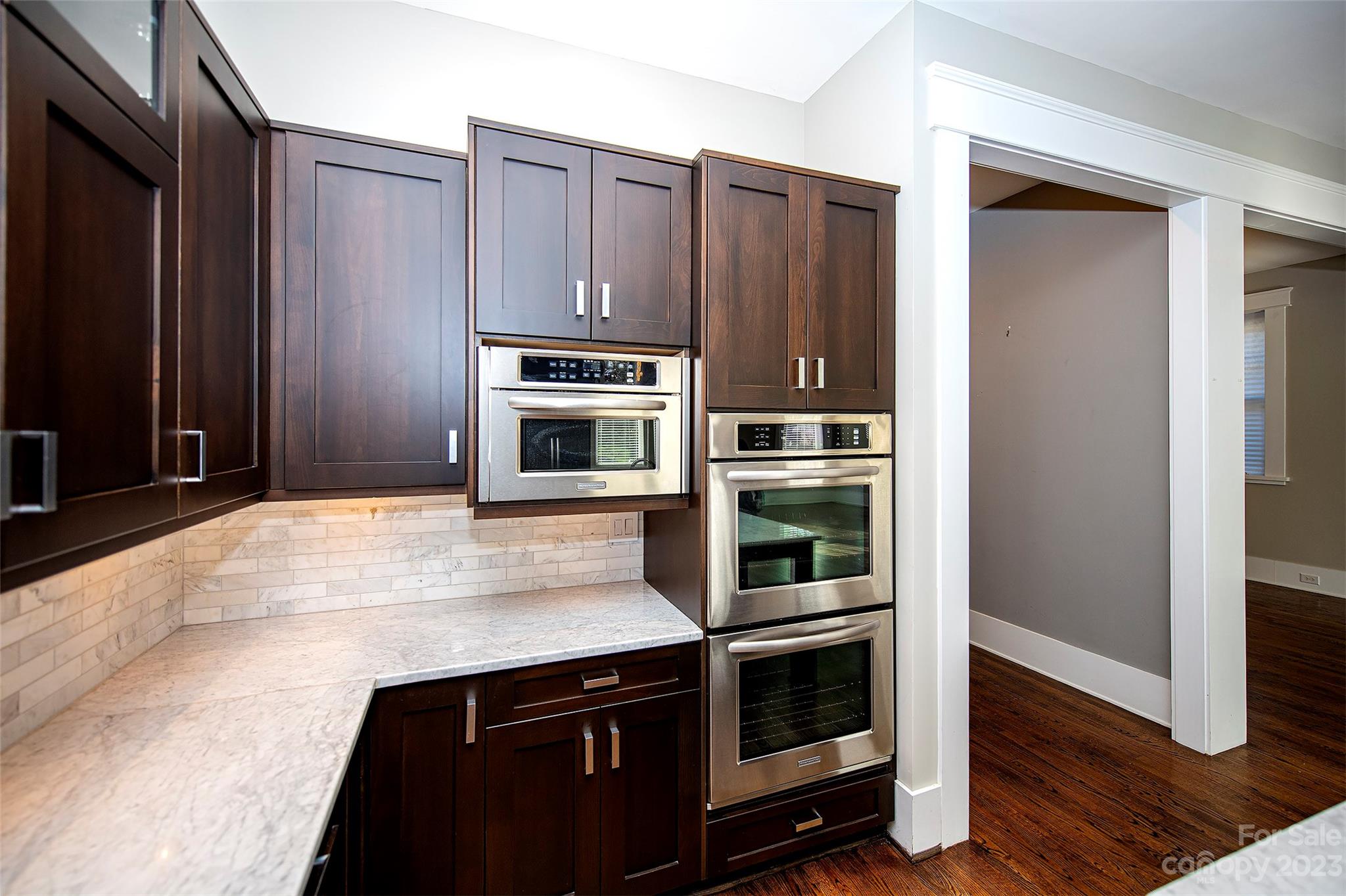 1403 Devon Drive Charlotte, NC 28209 - Photo 12 of 46 a kitchen with stainless steel appliances a stove and a refrigerator