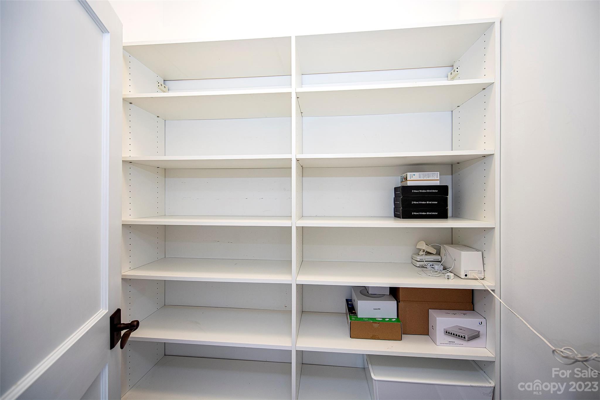 1403 Devon Drive Charlotte, NC 28209 - Photo 19 of 46 a view of an empty walk in closet