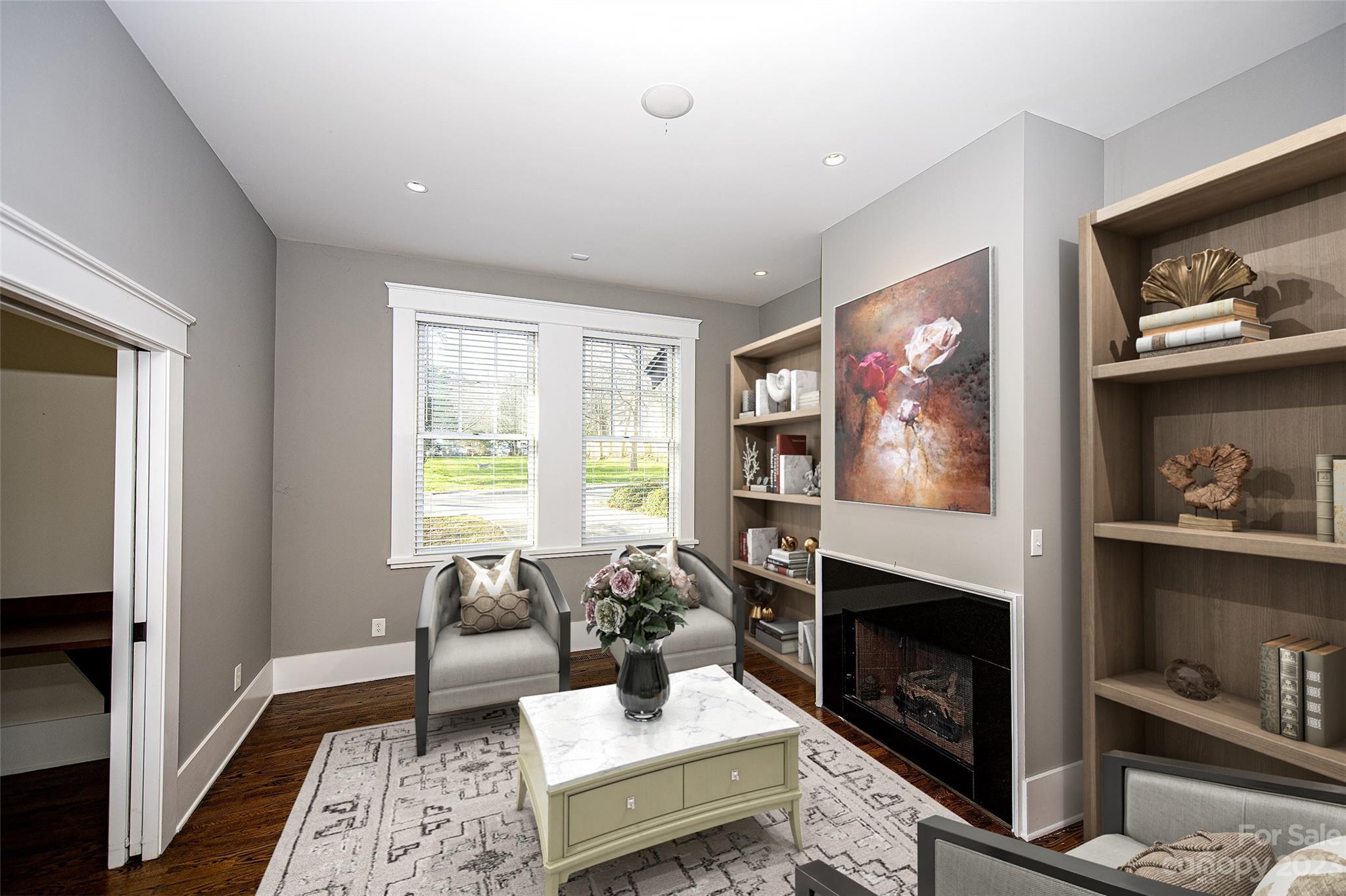 1403 Devon Drive Charlotte, NC 28209 - Photo 21 of 46 a living room with furniture and a fireplace